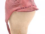 pink hat on a mannequin head on a white background