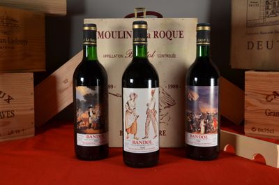 three bottles of wine sitting next to each other on a table
