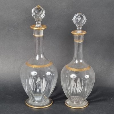 pair of antique cut glass decanters with gold trim