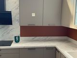 a picture of a kitchen with a marble counter top