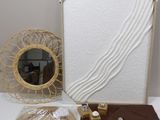 a picture of a table with a picture frame and other items on it