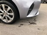 a close up of a car ' s tire on a parking lot