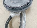 a close up of a shower head on a tiled floor