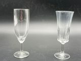 two empty wine glasses sitting on a table