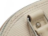 a close up of a purse with a metal handle