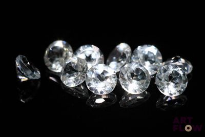 some very pretty white diamonds on a black surface
