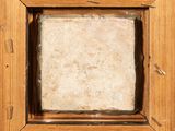 an image of a picture of a wooden frame with a stone in it