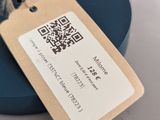 a tag that is attached to a blue umbrella