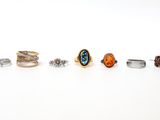five different types of rings on a white surface