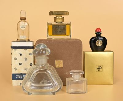 many different types of perfume bottles on the table