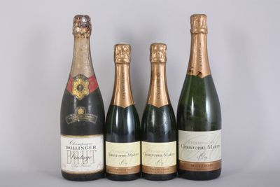 three bottles of champagne sitting next to each other on a table