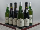 six bottles of wine are lined up in a row on a wooden tray