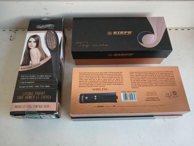 two boxes of hair brushes sitting on a shelf next to each other
