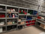 a room with a lot of shelves and bins in it