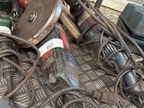 a pile of tools sitting on top of a metal table