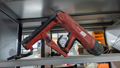 a picture of a stapler on a shelf in a room