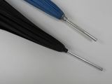 two black and blue umbrellas on a white surface
