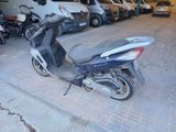 a scooter that is parked in a garage