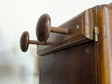 a close up of a door handle on a wooden door