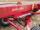 a red tractor that is parked on the side of the road