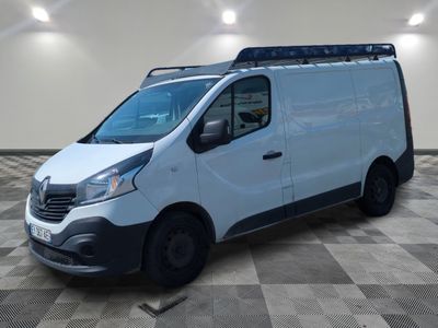 the white van is parked on a checkered floor in a room