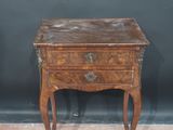 an old wooden table with a drawer on top of it
