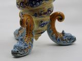 a figurine of an octopus on a white surface