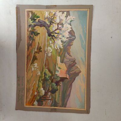 a painting hanging on the wall next to a vase