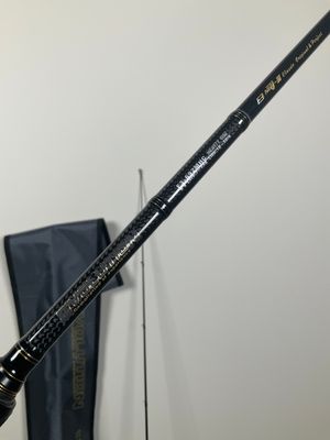 a close up of a person holding a fishing rod in their hand