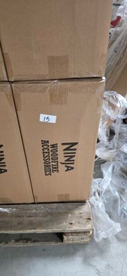 a stack of boxes sitting on a pallet in a warehouse