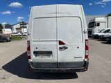 a white van that is parked in a parking lot