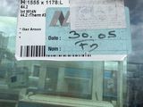 a picture of a bus ticket with a picture of a building in the background