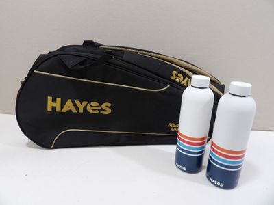 two bottles of water and a bag on a table