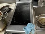 a pot and pan on the stove in the kitchen