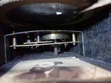 a close up of a clock inside of a black box