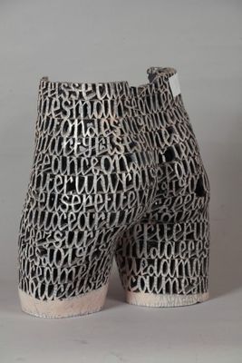 an image of a pair of black and white shoes with letters on them