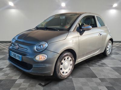 a picture of a small car parked in a garage