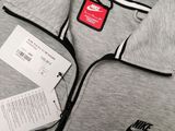 the nike jacket has a tag on it and a tag on the back of it