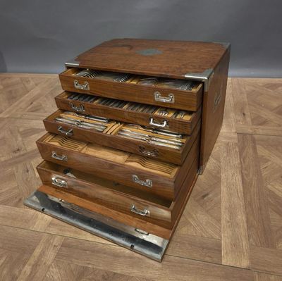 an image of a wooden file cabinet on a wooden floor