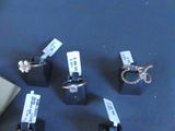 five different types of rings on display on a table