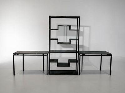 two tables and a shelf in the middle of a room