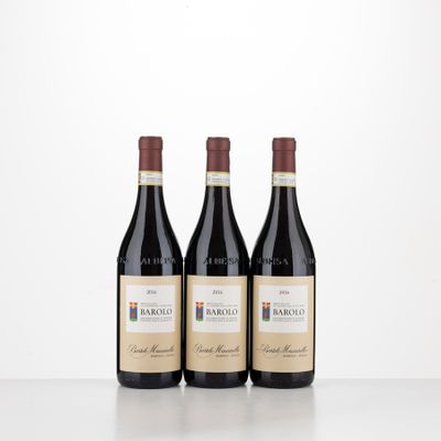 three bottles of wine sitting on top of a table next to each other