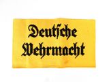 a close up of a yellow cloth with black writing on it