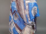 an image of a mannequin dressed in a blue and white scarf