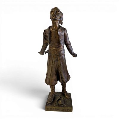 bronze statue of a man with a hat and coat on a base