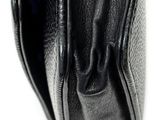 the inside of a black leather purse with a zipper on it