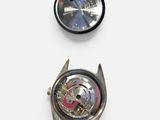 three different types of watches are shown on a white surface