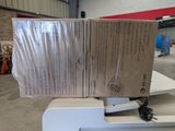 a stack of boxes sitting on top of a printer