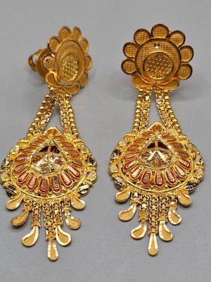 a pair of gold earrings with red and white stones