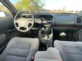 the interior of a car with a dashboard and a steering wheel